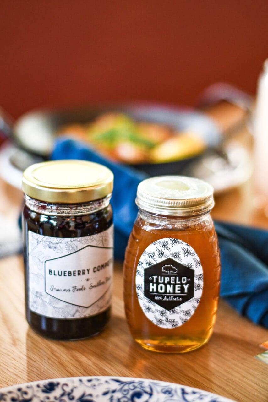 a jar of tupelo honey on a table