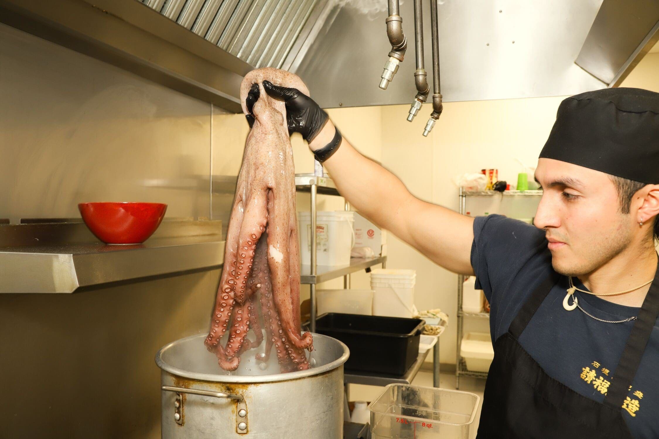 Chef Julio Cajas cooking octopus for their famous La Torre Imperial (a ceviche dish).