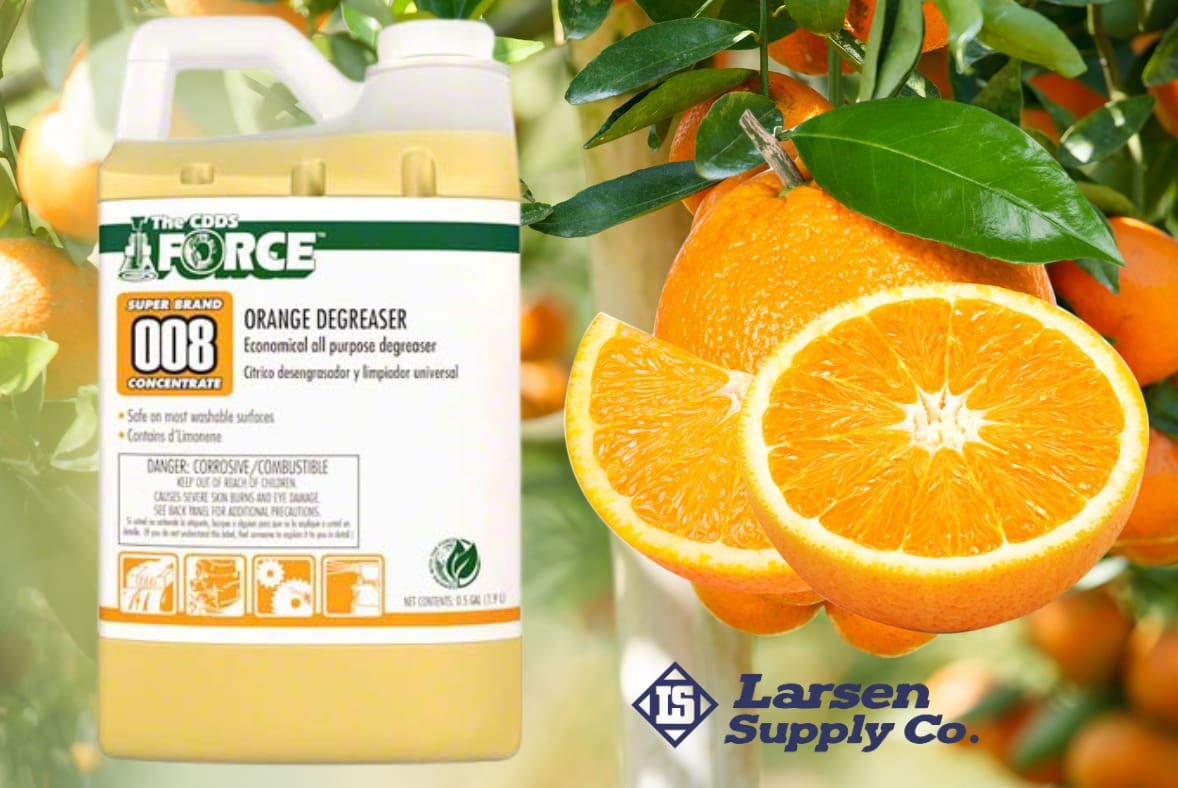 large container of cleaning that has oranges next to it from larsen supply co