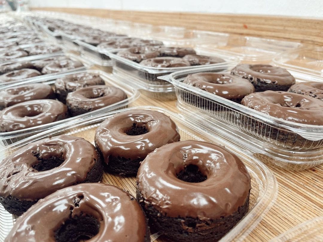 rows of fresh keto donuts ready for packaging at the omaha bakery