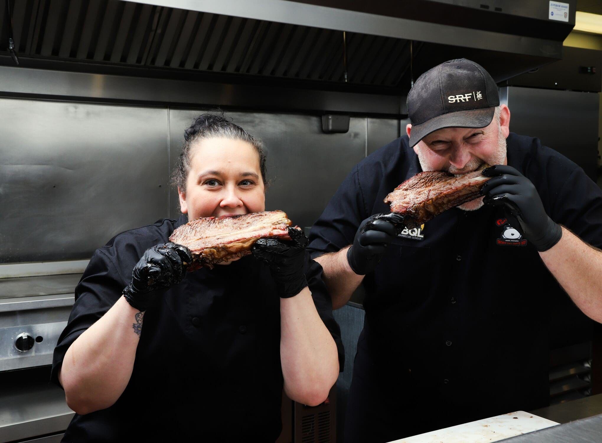 Chef Michelle Alfaro and Blane Hunter eat waygu beef at porky butt's bbq